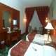 غرفة  فندق رمادا الحمرا - المدينة المنورة | هوتيلز بوكينج