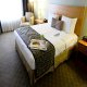 غرفة نوم بالجناح فندق بلاتينيوم - لاس فيجاس | هوتيلز بوكينج